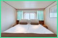 An old Holland America cruise ship is turning residential, letting travelers live at sea for $8,000 a month while it circumnavigates the globe